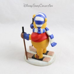 Figurine en porcelaine DISNEY Winnie fait du ski